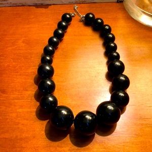 Black beaded necklace. Approx length 18 inches.